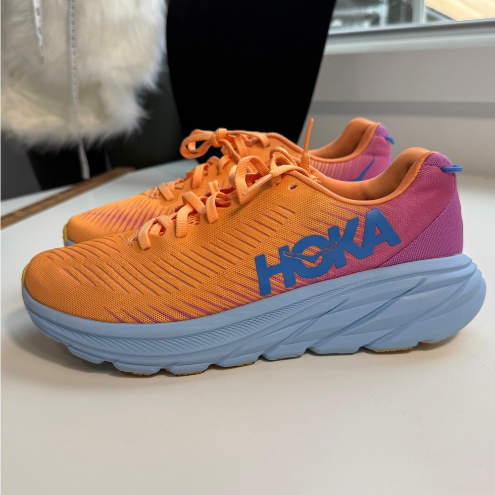 Hoka Orange Rincon 3 women’s Running Shoe with Blue Logo Accent